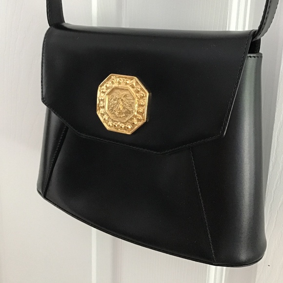 YSL Black Leather Handbag with YSL gold tone logo in the front - Picture 5 of 12